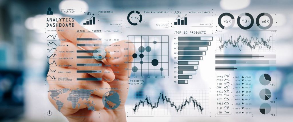 Man using business management software to analyze company metrics.