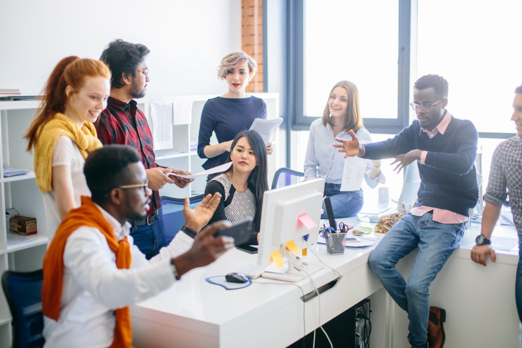 Closeup portrait of successful company with people of different ethnic origins.