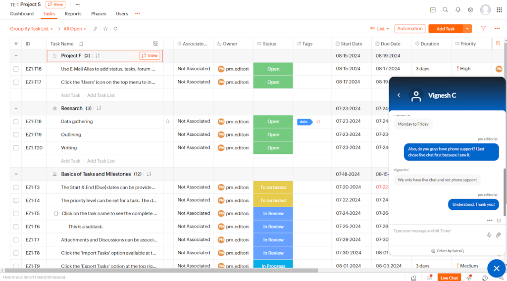 A live chat text window in the forefront of a Zoho Projects task board with a response regarding support channel options.