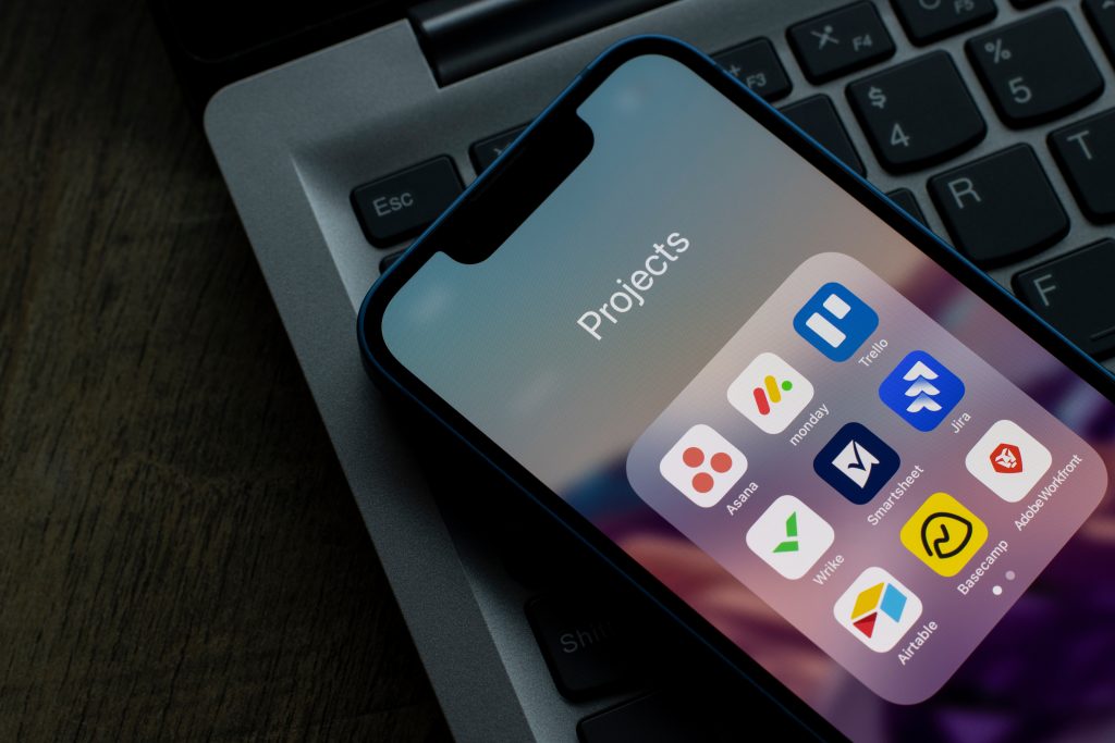 iphone projects folder opened to logos of 9 popular project management titles.