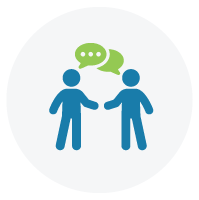 Two people with speech bubbles to represent communication.