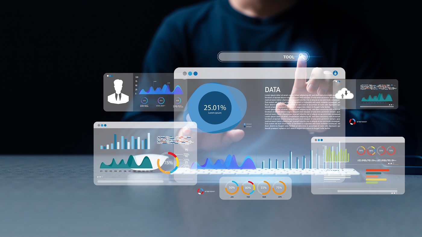 An analyst uses a computer and dashboard for data business analysis and Data Management System with KPI and metrics connected to the database for technology.