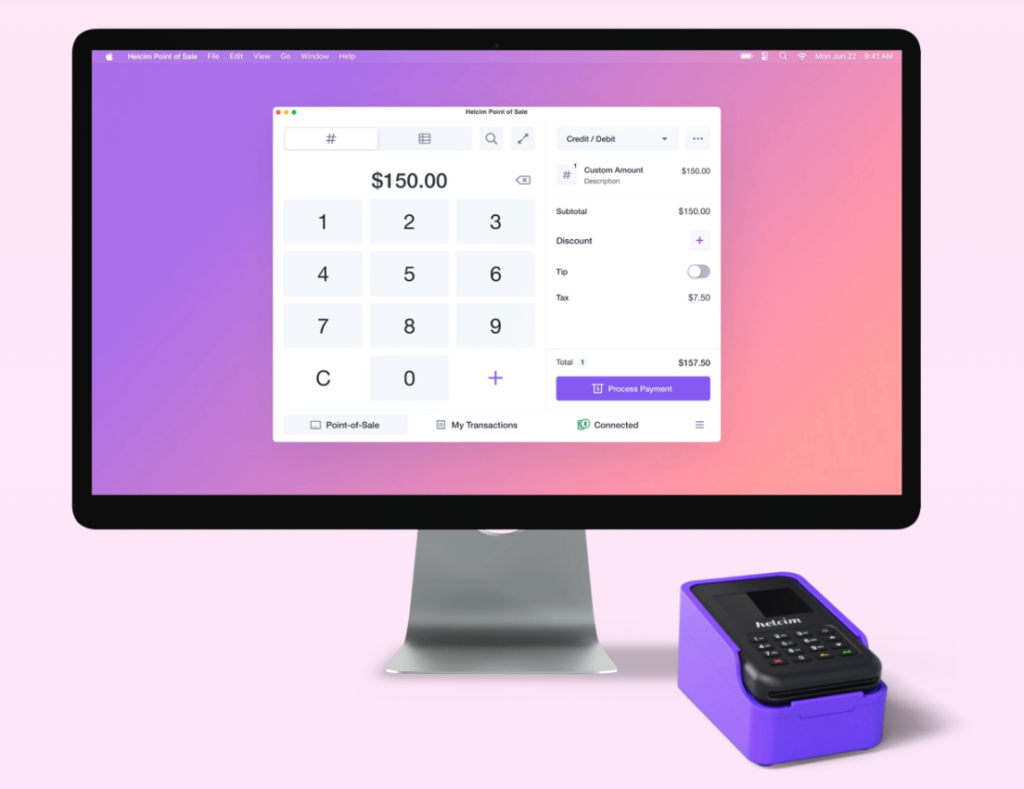 Helcim POS on desktop with Helcim card reader next to computer.