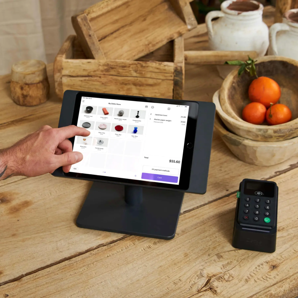 PayPal zettle POS checkout page with person tapping screen.