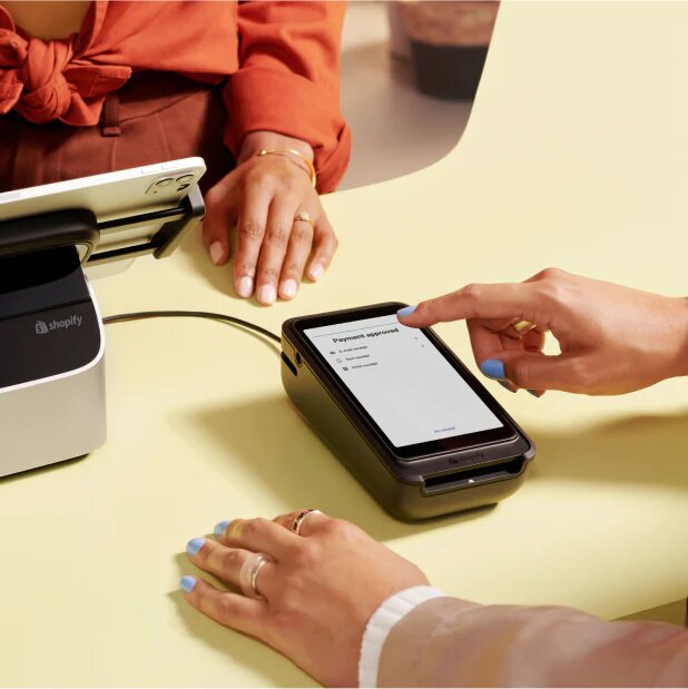 Shopify Go used as a customer-facing payment terminal attached to an iPad countertop register.