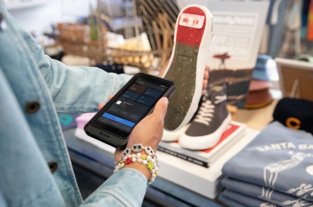 Shopify Go's built-in barcode scanner being used to scan a pair of shoes.