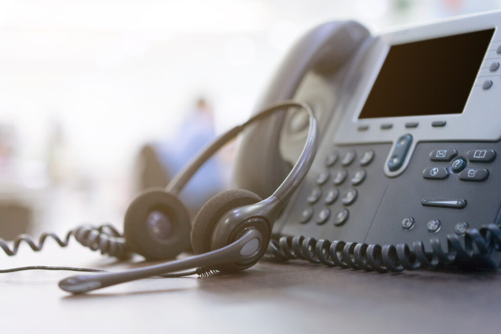 A VoIP telephone and headset.