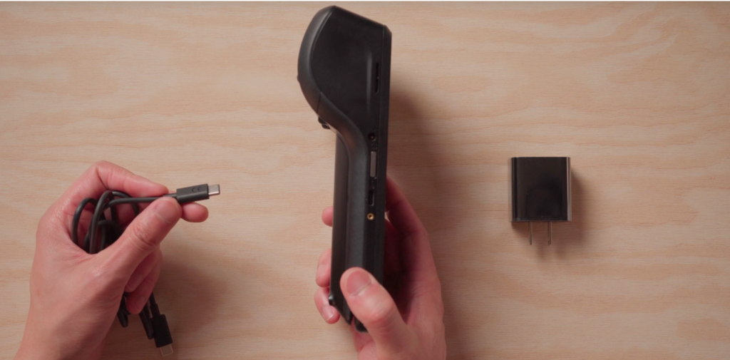The Helcim Smart Terminal kit includes the Smart Terminal card reader, USB charging cables, and paper roll.
