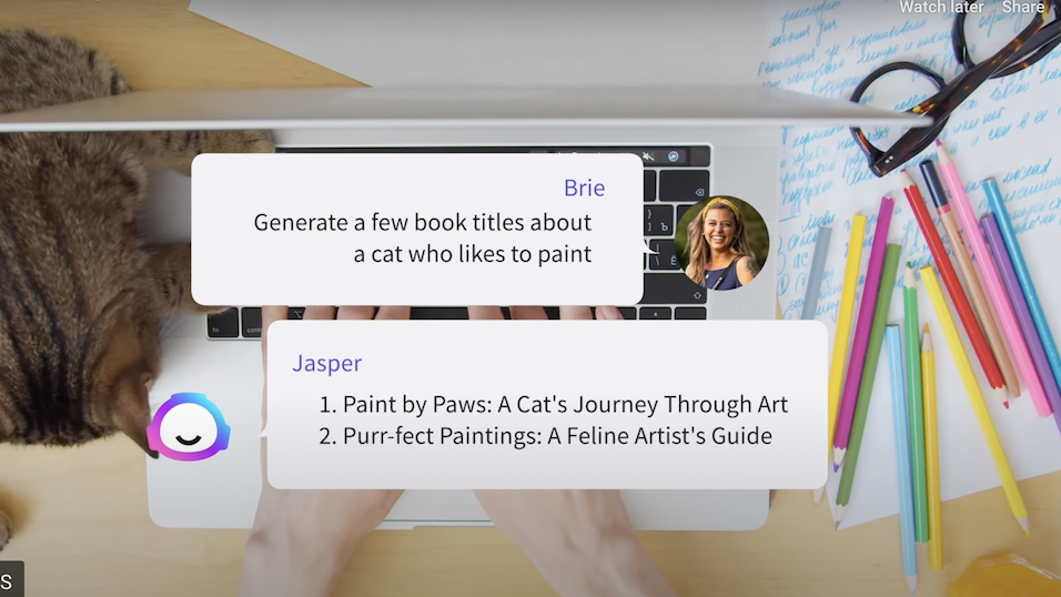 Jasper chats with a user, asking how to improve book titles with a laptop in the background.