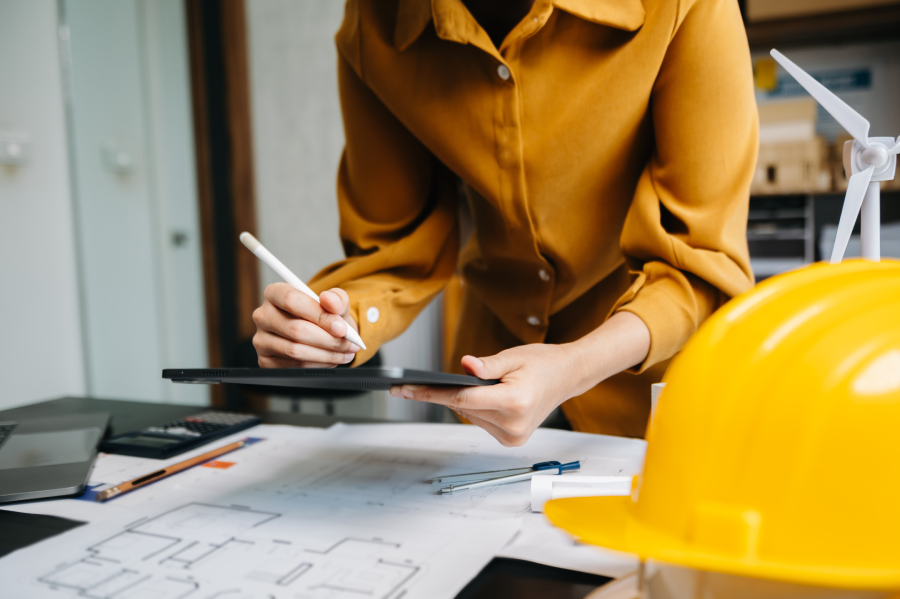 A project engineer working on a construction plan.