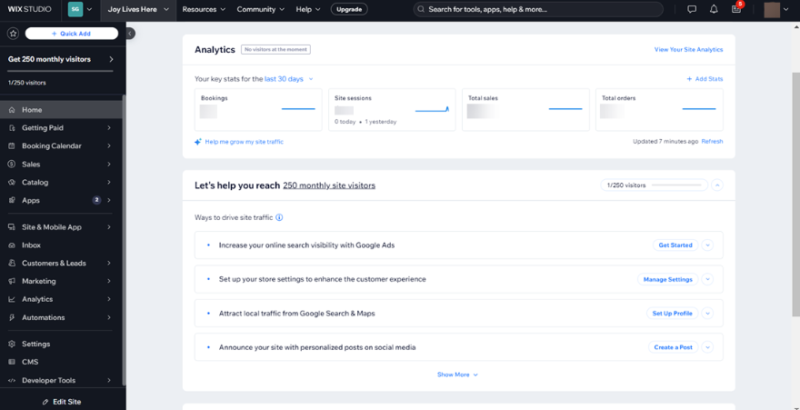 Wix Studio analytics dashboard displaying site sessions, total sales, bookings, visitor insights, and traffic growth recommendations.
