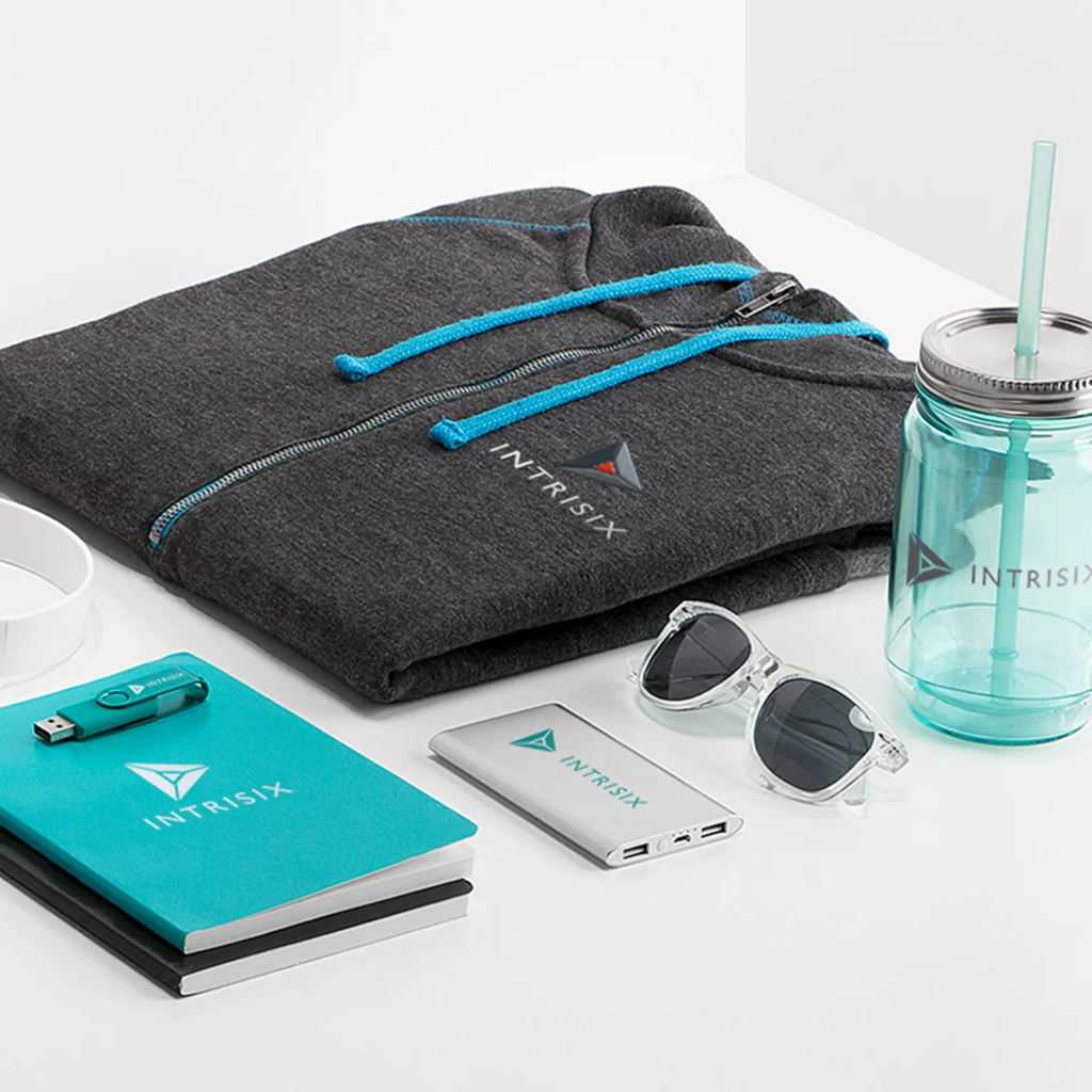 Branded promotional products including hoodie, tumbler, notebook, power bank, and sunglasses used for small business marketing