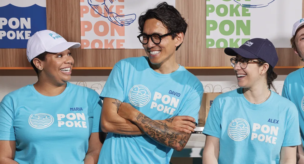 Employees wearing branded t-shirts and hats as part of small business marketing and team branding