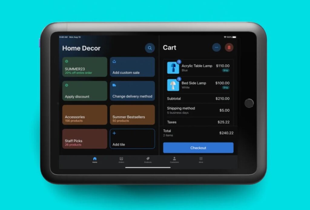 Shopify POS tablet screen showing product tiles, order details, discounts, delivery options, and checkout.