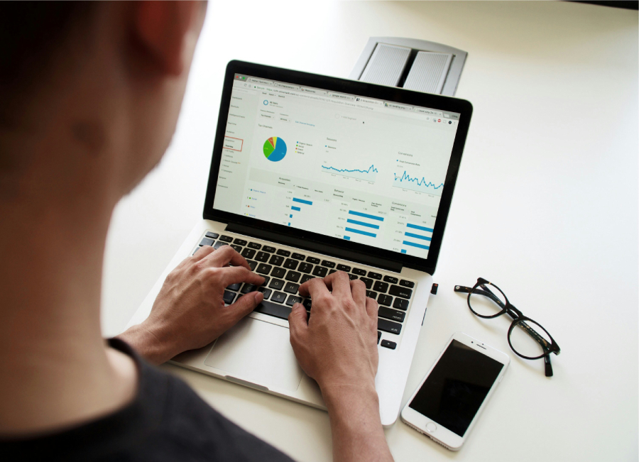 A person using a laptop to create marketing campaigns.